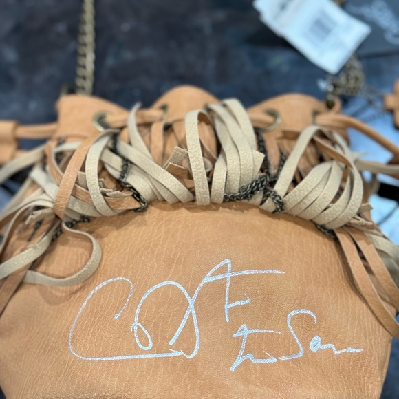 AUTOGRAPHED Carlos Santana drawstring Crossbody bag and collectible keychain - Picture 5 of 12